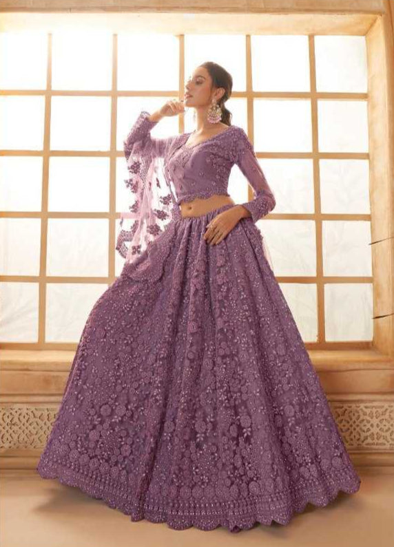 Woman wearing a purple embroidered dress in front of a window, with 'Alizeh' branding.