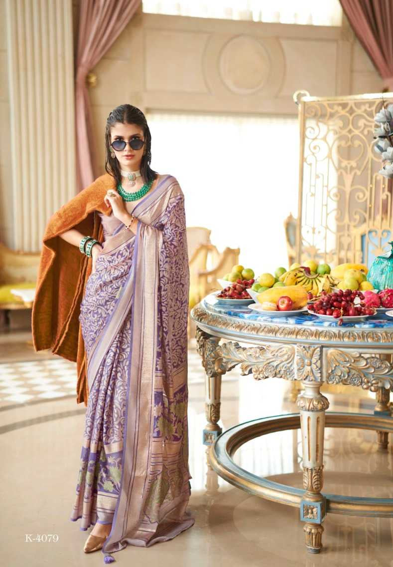 Woman in a saree with jewelry in a decorated room with fruit and decor.