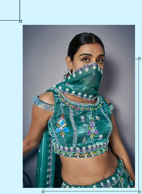 Teal embroidered traditional outfit with matching scarf, displayed against a neutral background.