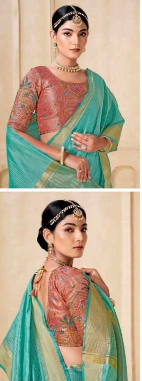 Woman wearing a turquoise saree with a green border in an indoor setting.